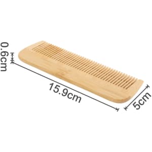 A fine-tooth bamboo comb in natural bamboo colour, measuring 15.9 cm by 5 cm. The comb features a smooth, rounded edge and has a logo.