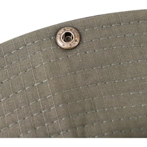 A close-up of an olive green outdoor brim hat, featuring a metal fastener.