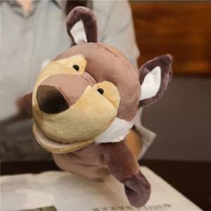 A plush wolf hand puppet in brown and cream colours, featuring expressive eyes and ears, held in a person's hand.