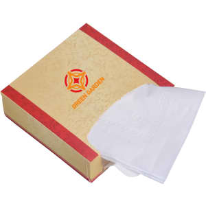 A decorative mini tissue box in a cream and red design, containing white tissues and featuring a logo.