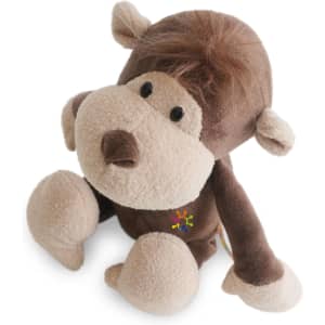 A brown and beige plush monkey toy with a smiling face and floppy limbs, featuring a small logo on its body.