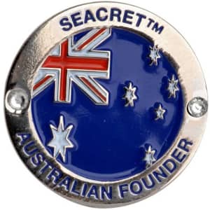 A circular embossed soft enamel pin featuring a blue background with the Australian flag and stars, bordered in silver.