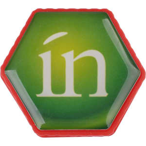 A hexagonal flash drive in green and red, featuring the word "in" in white on the surface.