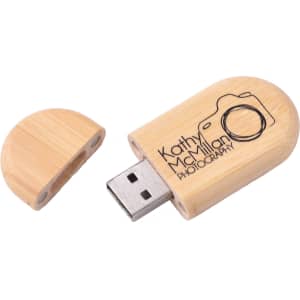 An oblong wood flash drive in natural wood colour with a removable cap and a logo engraved on the surface.