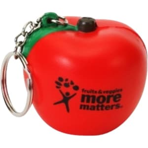 A red apple-shaped stress reliever with a keyring attachment and a logo on one side.