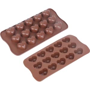 Two brown silicone moulded ice cube trays shaped like hearts, with multiple cavities for ice cubes.