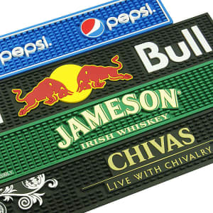 A collection of moulded PVC bar runners in blue, black, and green featuring various logos and colourful designs.