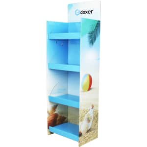A premium cardboard floor display in blue with three shelves, featuring a beach scene and a logo.