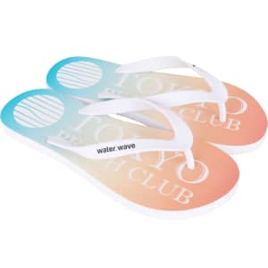 A pair of gradient orange and blue flip flops with white straps and a logo on the footbed.