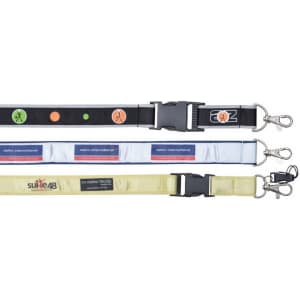 Three lanyards in various colours: black with patterns, white with branding, and yellow with a logo. Each has a clip.