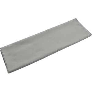 A grey quick dry towel with a smooth surface and stitched edges, featuring a small logo.