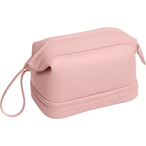 A large capacity pink PU toiletry bag with a zip closure and a loop handle. It features a logo on the exterior.