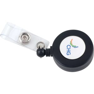 A round black retractable card holder with a clear strap and a logo on the front.