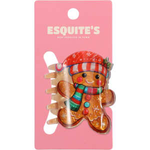 A gingerbread man hair claw in festive colours, featuring a red hat and scarf, on a pink backing with a logo.