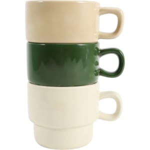Stackable ceramic mugs in beige, green, and off-white, arranged in a neat stack. The mugs have handles and a smooth finish.