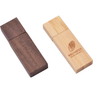 A rectangular wooden flash drive featuring a dark wood finish and a light bamboo finish, both with branding.