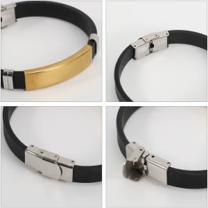 A metal buckle latch bracelet featuring a gold and silver design with a black band. Includes branding on the metal.