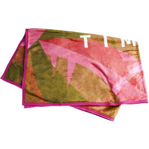 A flannel blanket featuring a colourful design with shades of pink, green, and brown, bordered with pink.