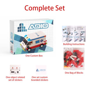 A box for "Car Series Building Blocks" featuring a red and white ambulance design, including instructions and a bag of blocks.
