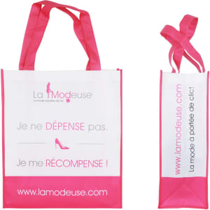 A pink and white laminated non-woven bag with large gusset and two handles. Features a logo and promotional text.