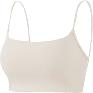 A seamless thin-strapped U-back crop bra tank in a light beige colour, featuring a simple design and no visible branding.