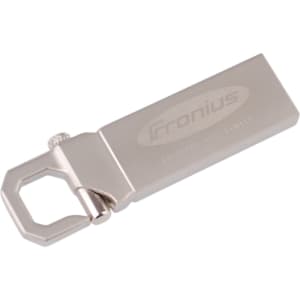 A silver flash drive with a sleek design and a distinctive attachment feature. It has a logo on the side.
