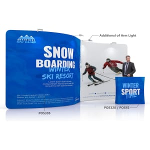 A fabric display wall featuring an S-shape, with a blue background and images of skiers. Includes a logo.