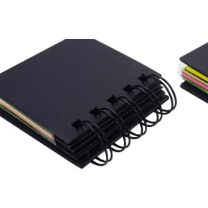 A black, 4-layer recycled sticky notepad with colourful notes visible. It has a binding with rings and additional notepad on the side.