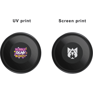 Two black circular products feature different printed designs: one with vibrant text and the other with a logo.