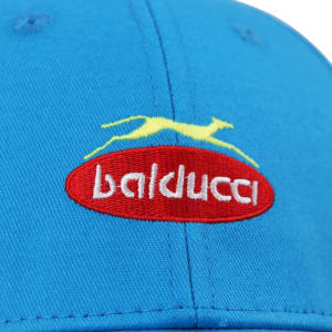 A blue sport cap with a flap and an embroidered logo in red and yellow.