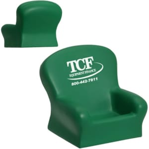 A green stress reliever in the shape of a seat, featuring a logo on one side.