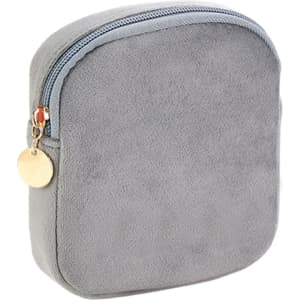A square, light grey mini makeup bag with a zip closure and a decorative charm. Designer logo visible.