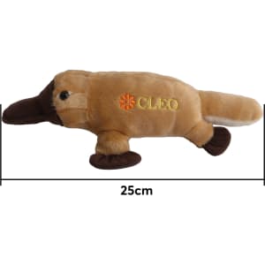 A brown and beige platypus plush toy, measuring 25 cm, with a logo on its side.