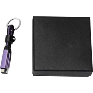 A braided charging cable in purple with a keyring attached, accompanied by a black gift box.