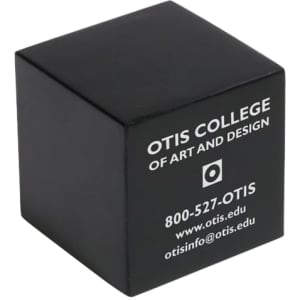 A black cube-shaped stress reliever with a logo and text on one side.