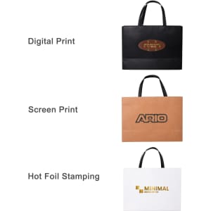 Three small paper bags with flat handles in black, brown, and white, each featuring a different branding technique.
