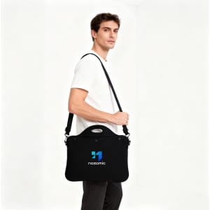 A black laptop bag with a handle, featuring a logo, carried by a person.