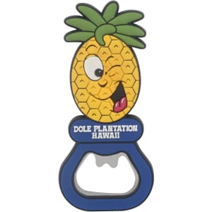 A drink bottle opener shaped like a smiling pineapple, featuring green leaves and a blue base. It has a logo on it.