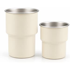 A stainless steel camping mug set in cream, featuring two sizes with a metallic inner lining and a simple design.