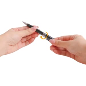 A metal pen in black being rotated by hands, showcasing its sleek design and functional features.