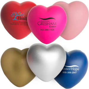 A range of heart-shaped stress relievers in red, pink, silver, gold, and blue, featuring various logos.