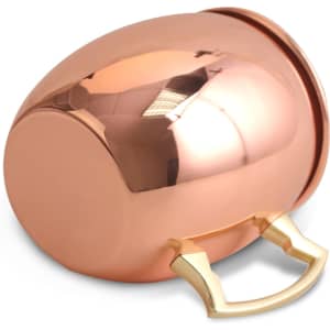 A copper mug with a gold handle, featuring a polished exterior and rounded shape, placed on a white background.