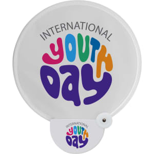 A white foldable fan featuring colourful text that reads "International Youth Day" in vibrant lettering.