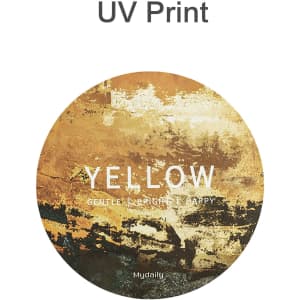 A round frosted metal coaster featuring a yellow abstract design with hints of earthy tones and a logo.