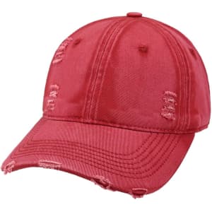 A vintage red baseball cap with distressed details and a curved brim, featuring a logo.
