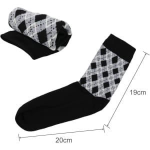 A pair of black and grey patterned socks, one rolled up, showcasing a woven design with a towel bottom.