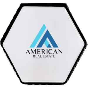 A hexagonal-shaped flash drive in white and black with a logo on the front.