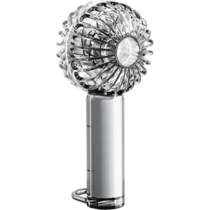 A transparent handheld fan with a round design and LED light, featuring a silver handle.