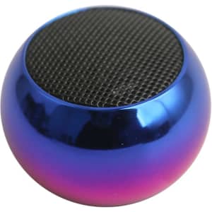 A small, round wireless speaker in iridescent blue and purple, featuring a textured mesh top and a logo.