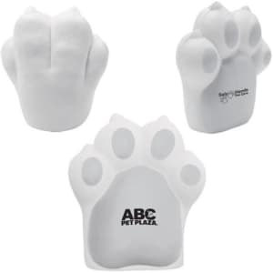 A dog paw-shaped stress reliever in white, featuring a logo on one side.